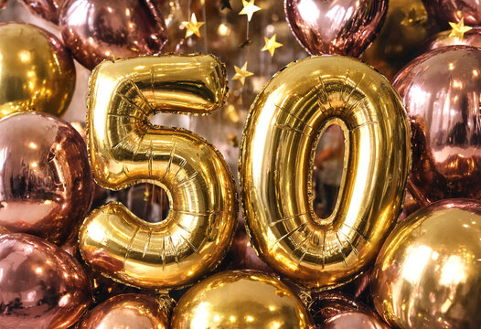 Golden foil balloons forming number fifty celebration decoration arrangement