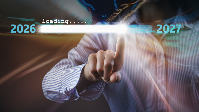 Woman touch on loading progress from 2026 to 2027.