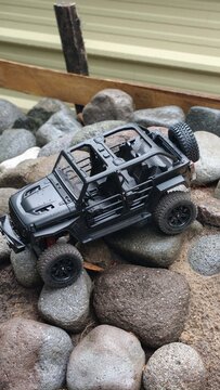 Black RC Crawler in rocks
