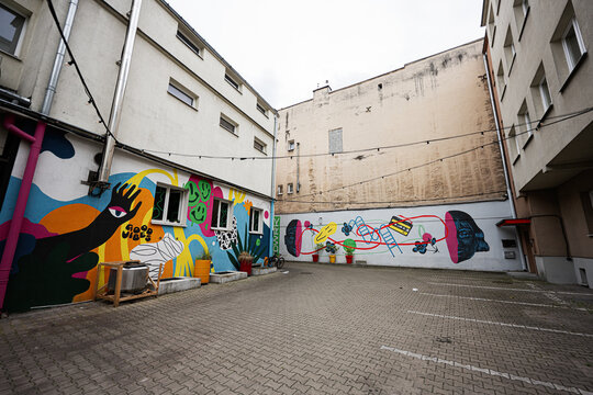 Colorful street art mural in a Radom Poland courtyard with abstract painted walls and urban architecture