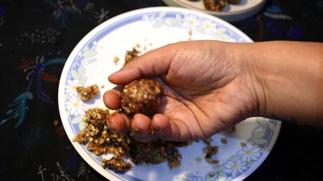 making healthy nuts and dates laddu for diwali celebration