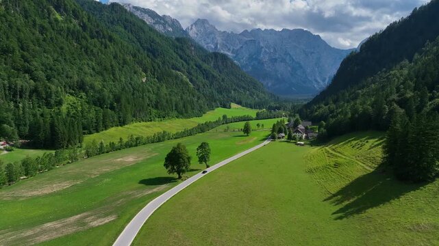 landscape with mountains stunning summer scenery with alpine meadows and mountains in slovenia logarska dolina and alpine forest with green fields from solcava panoramic road