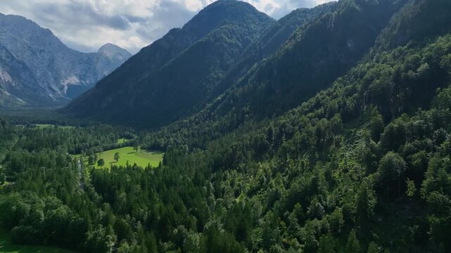 landscape with mountains stunning summer scenery with alpine meadows and mountains in slovenia logarska dolina and alpine forest with green fields from solcava panoramic road