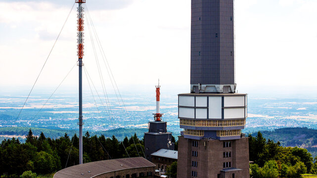 Aerial view of Grosser Feldberg with its prominent telecommunications tower and surrounding Taunus forest landscape in Schmitten im Taunus, Hessen, Germany.