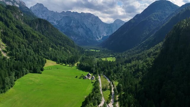 landscape with mountains stunning summer scenery with alpine meadows and mountains in slovenia logarska dolina and alpine forest with green fields from solcava panoramic road