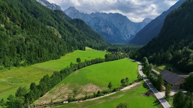 landscape with mountains stunning summer scenery with alpine meadows and mountains in slovenia logarska dolina and alpine forest with green fields from solcava panoramic road