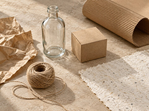 Sustainable packaging materials with glass bottle kraft paper and twine