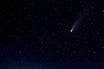 Abstract cosmic background with a comet © K.Pornsatid