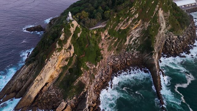 Aerial view of Getaria lighthouse on a dramatic cliff in Spain