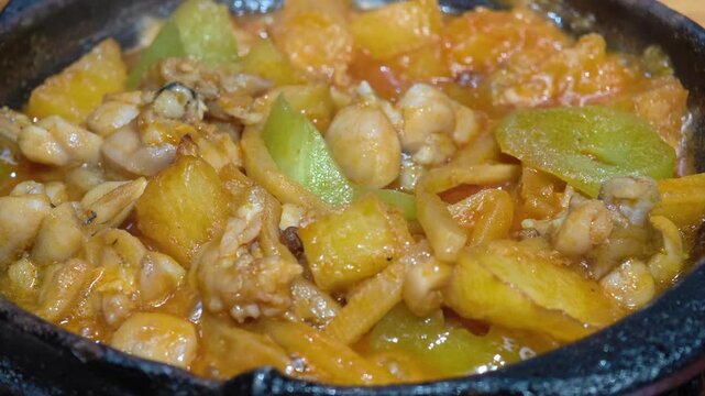 slow motion, Close-up cooked bullfrog pot with celtuce and potato