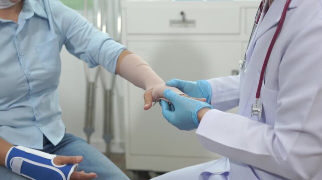 Doctor patient hand glove clinic care with bandage during gentle medical treatment