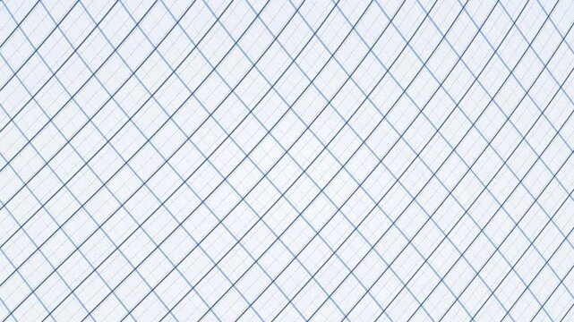 Diagonal wire mesh fence against overcast sky background