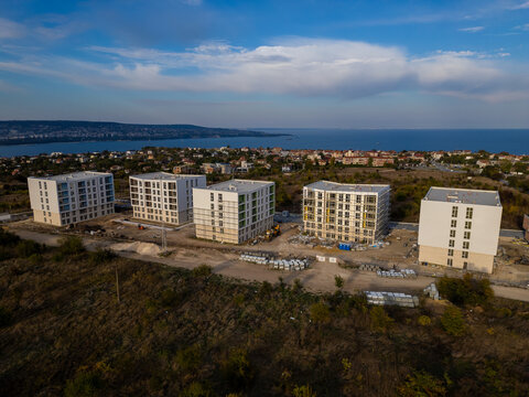Aerial view of new apartment buildings under construction near the sea coast