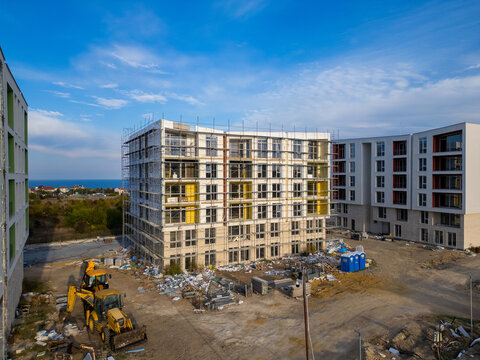 Aerial view of new apartment buildings under construction near the sea coast