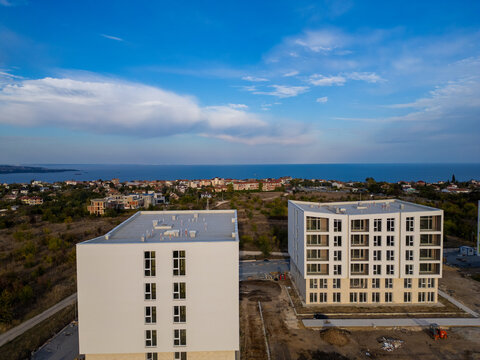 Aerial view of new apartment buildings under construction near the sea coast