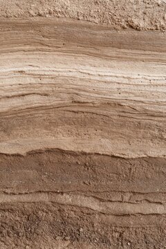 Horizontal sand and clay strata texture background for design and poster use, banded sediment surface for wallpaper and layout