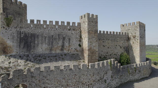 Aerial view of Montemor-o-Velho Castle featuring stone walls, defensive towers, and battlements in Montemor-o-Velho, Coimbra District, Portugal.