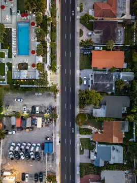 Aerial view of Four Seasons Hotel at The Surf Club with its swimming pool and surrounding residential area in Surfside, Florida, United States.