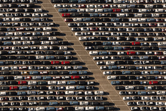 Aerial view of a large parking lot filled with numerous cars arranged in neat rows in Vallejo, California, United States.