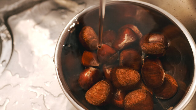 Chestnuts soaking in a bowl of water
