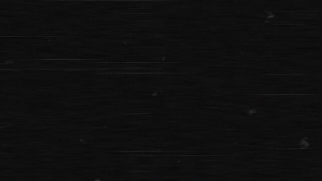 4K horizontal looping video featuring dark VHS static, subtle scan lines and scattered analog tape defects for retro glitch backgrounds and cinematic overlays.