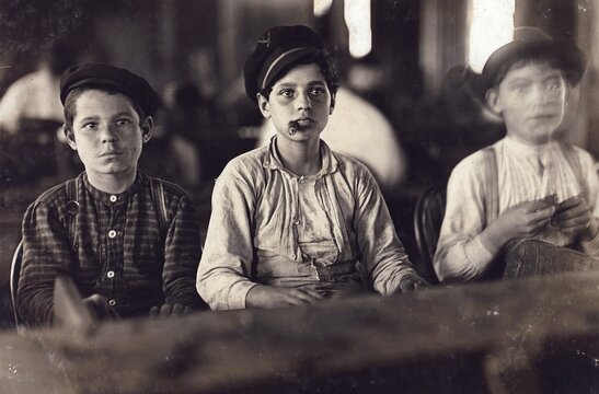 Child labour, Young cigar makers at Englahardt & Co, Tampa, the boys there were under 14 years old. There was a lull in work and the youngsters were hardly employed. The youngsters are all smoking, 1909, America, Photo by Lewis Wickes Hine, 1874-1940, Historic, digitally restored reproduction from an original of the time
