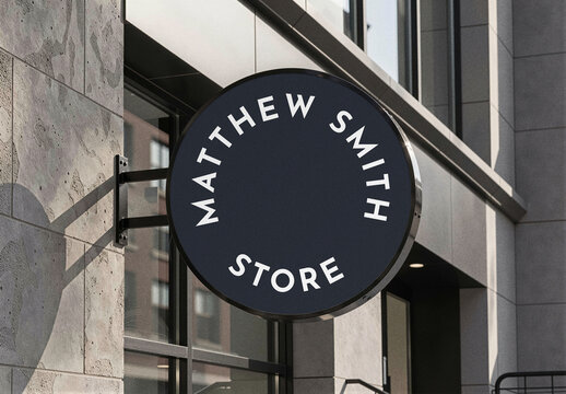 Round Hanging Shop Sign Mockup Template on Bracket at Stone Storefront, Circular Store Signage for Logo Branding and Business Identity Presentation, Realistic Outdoor Advertising Scene