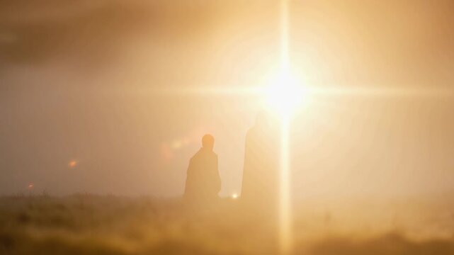 Two silhouetted figures stand in awe of a powerful sunrise, creating a profound sense of hope and new beginnings against a hazy. ..Created with Generative AI, not depicting real subjects.