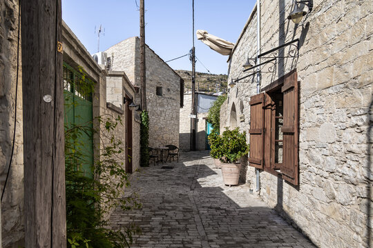 Cobblestone quiet a narrow Panagias Chalkidikis Street lined with old houses in mountain Omodos village in Cyprus