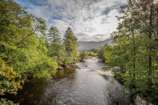 The Abhainn Shira river passes beneath Victoria bridge as it flows towards Loch Tulla near Inveroran in Scotland