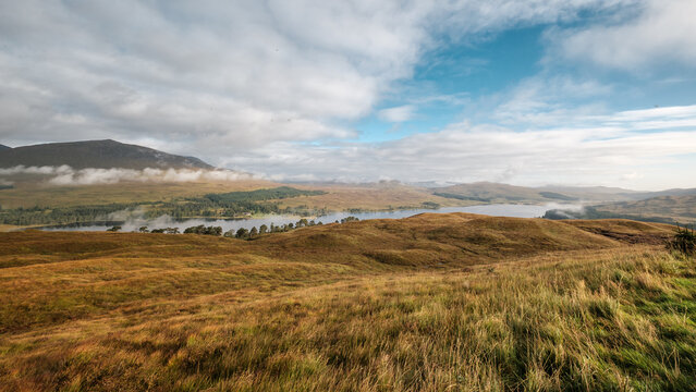 View of Loch Tulla over the heather moors from the West Highland Way trail near Inveroran in Scotland