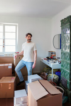 Man Moving Into Apartment With Moving Boxes