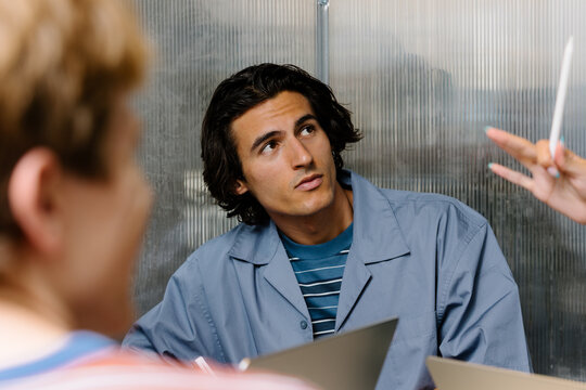 Attentive young businessman during an investor meeting in an office.