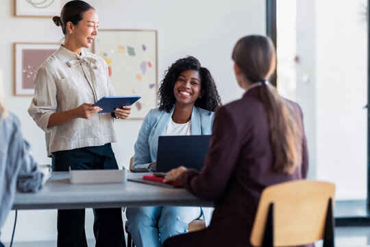 Businesswomen Smiling During Business Meeting in Office