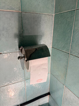 Lipstick mark on a toilet paper