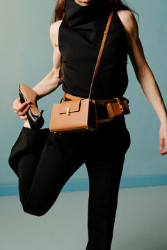 Fashion Model Posing With Handbag And Heel