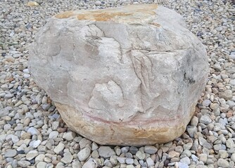 Large Limestone Boulder Rock on White Gravel Pebbles Ground for Garden Landscaping Decoration © Douren