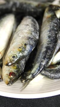 Sardines fish fresh small seafood pescatarian diet serving size fish&nbsp;natural ingredients healthy eating, wholesome dish, tasty snack fresh, gourmet, rustic food background on the table top view copy s