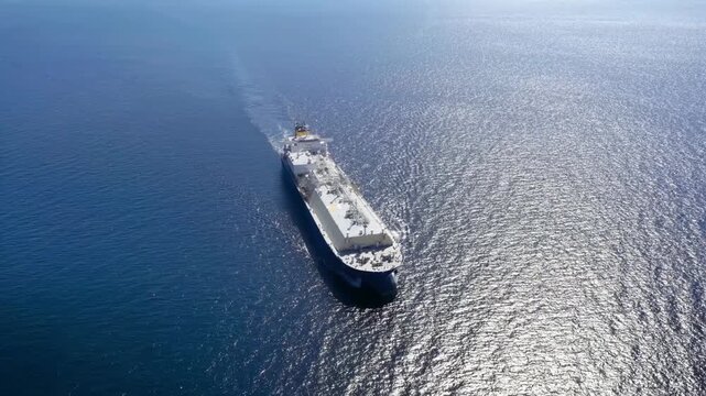 High Aerial top view of a big LNG or fossil fuel tanker in motionn as a concept for transport and energy