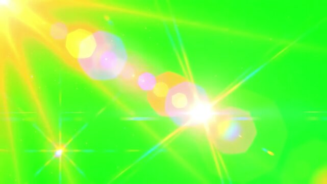 Golden sun rays and bright lens flares flickering across a solid chroma key green screen background for video editing