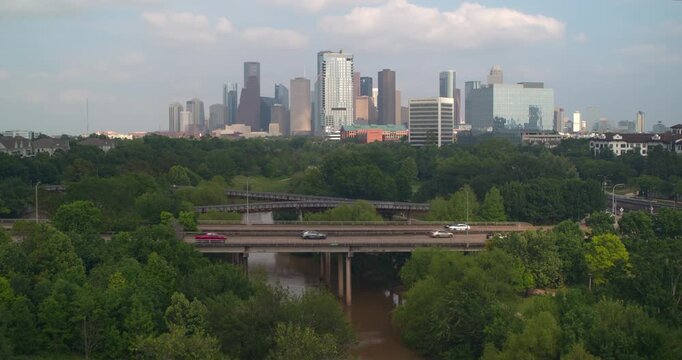 Drone Shot of Houston Skyline Rising Above Buffalo Bayou Park