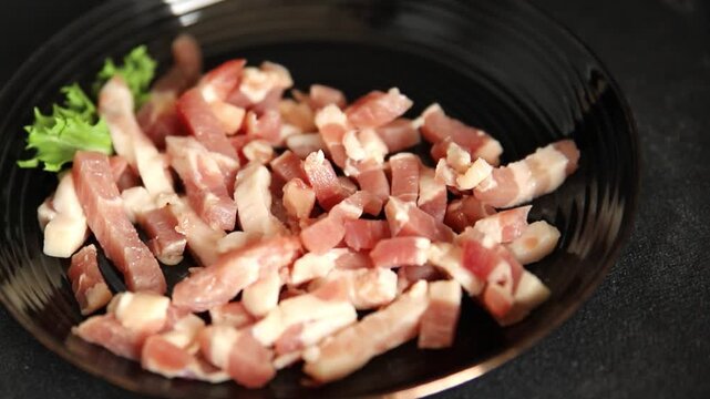 Bacon sliced into pieces pork meat lard serving size natural ingredients eating dish, tasty snack fresh, gourmet, rustic food background on the table top view copy space
