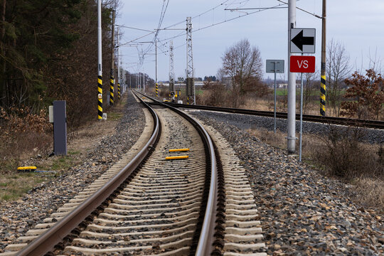 Railway Tracks with Switch, Overhead Lines and Traffic Signs