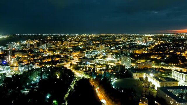 Lipetsk, Russia. Cathedral of the Nativity of Christ and historic city center, Drone footage at twilight with golden streetlights illuminating the skyline. Drone footage