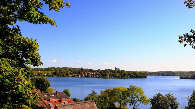 the big ploener lake with ploen cityscape  in germany 4k video with a pan