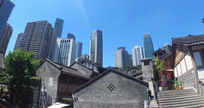 Traditional Chinese Rooftops Contrasting with Modern Skyscrapers in Chongqing, China