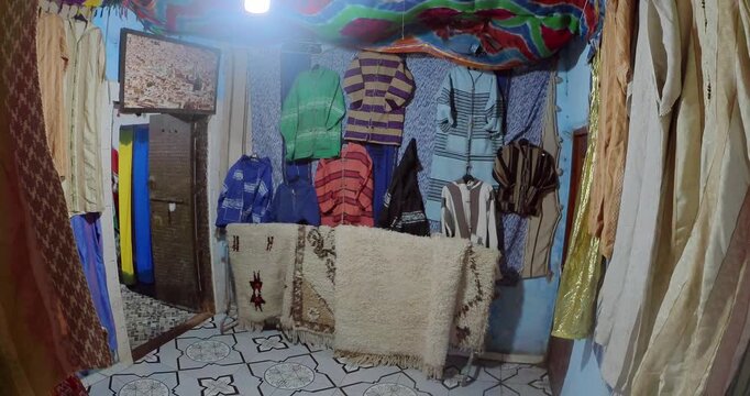 Traditional Moroccan Clothing Shop Displaying Colorful Garments and Handmade Textiles in Morocco