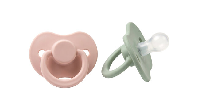 Minimalist baby pacifiers set, pastel pink and sage green silicone dummy soothers, modern newborn nursery accessories isolated PNG with Transparent Background