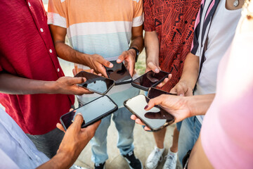 Obraz na płótnie Canvas Diverse friends connecting online using mobile phones