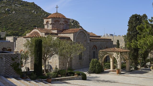 Stone church with dome in a mountainous landscape with trees, woman's monastery, Evangelismou Monastery, Patmos, Dodecanese, Greek Islands, Greece